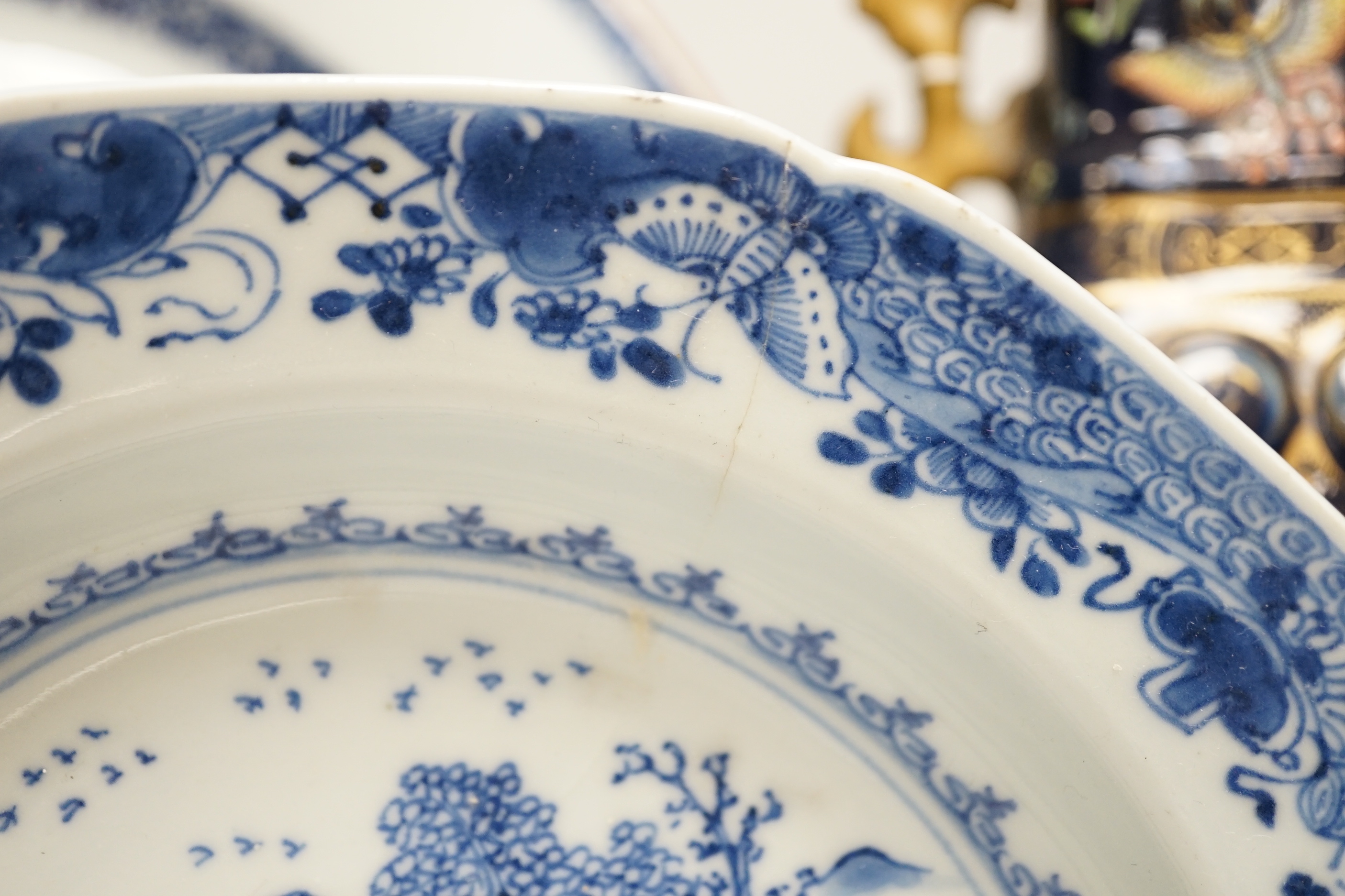 An 18th century Chinese export blue and white charger, a similar soup bowl and a late 19th century enamelled blue ground vase, 32cm